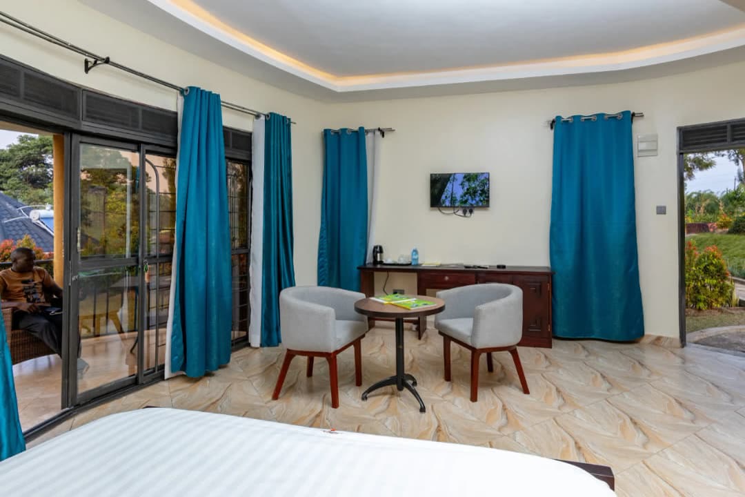 A cottage room with doors open onto the balcony