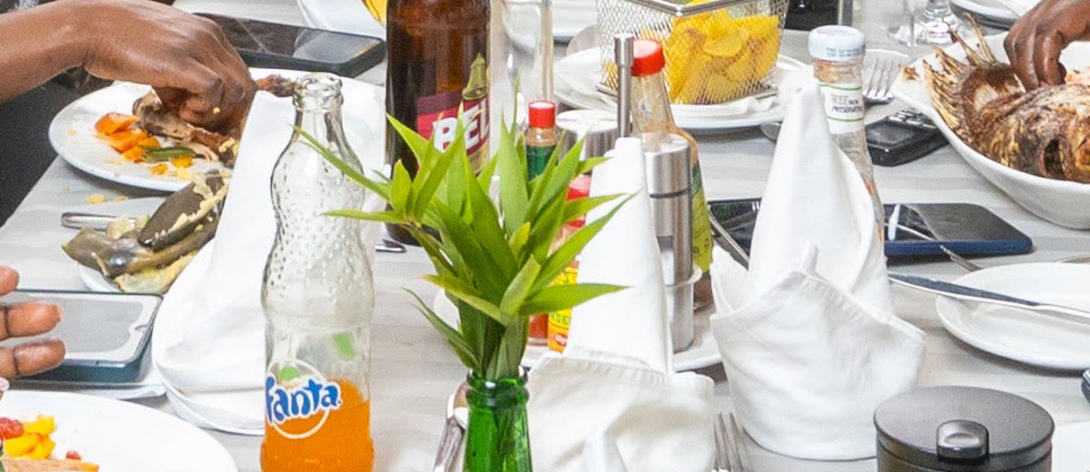 A bottle of Fanta on a set table
