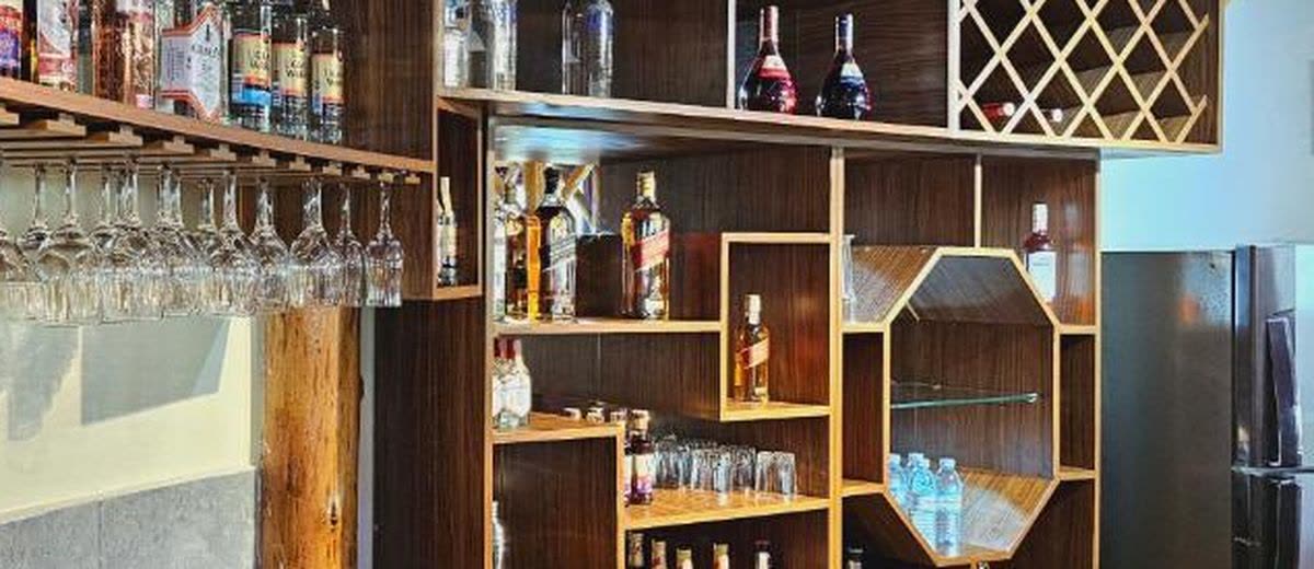Glasses and bottles on the shelves of Turaco Bar