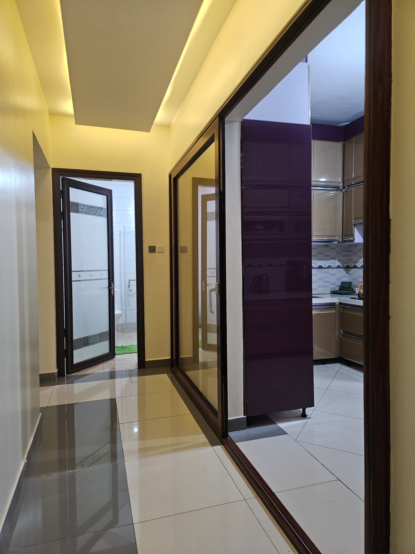 A hallway with polished floors leading through the villa