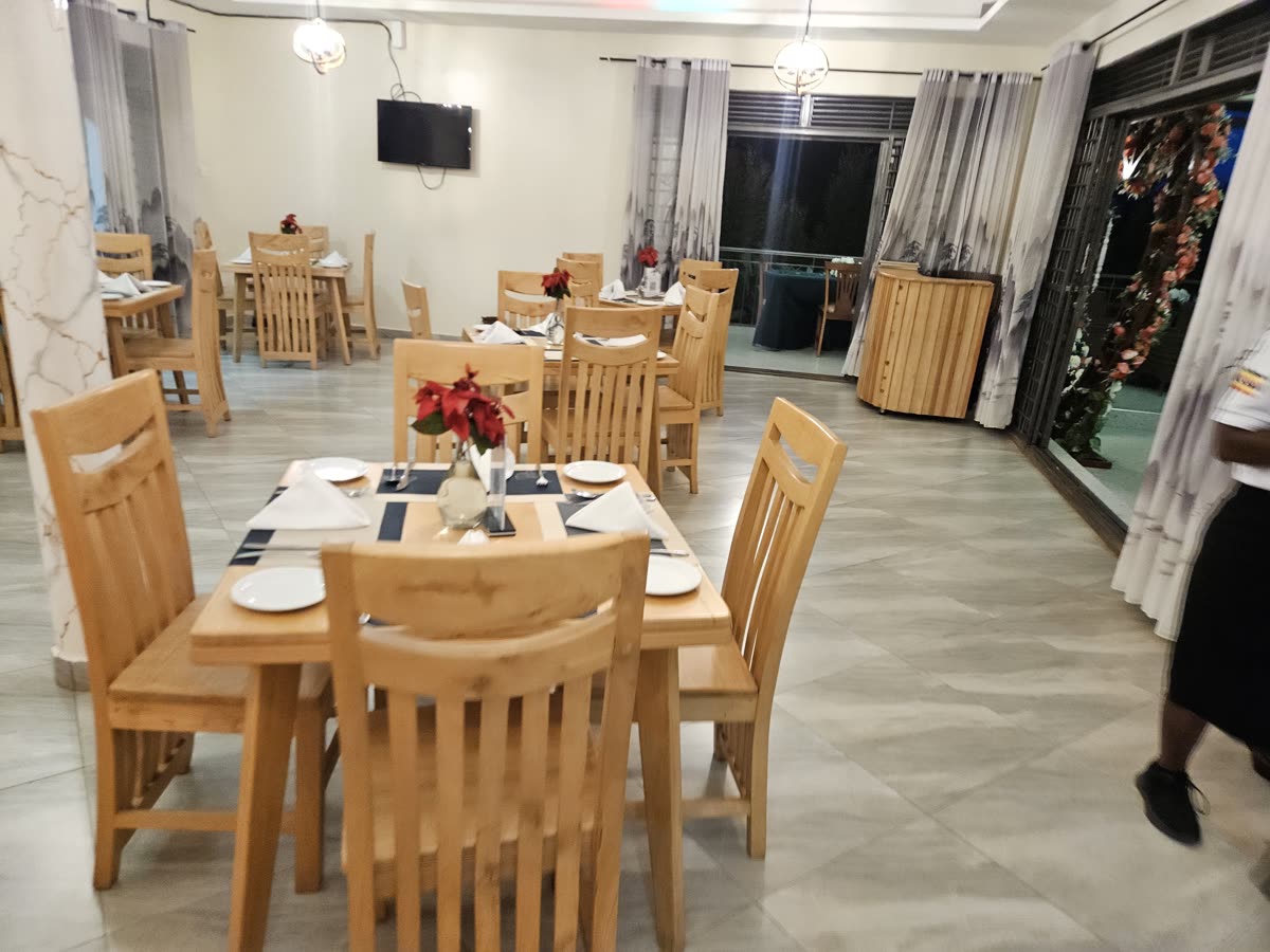 Set tables with red flowers in Turaco Restaurant